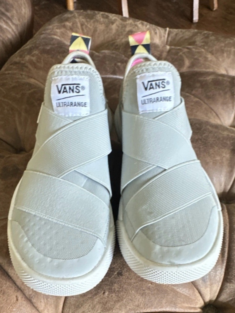 Vans slip-on sneakers with pink, black and cream geometric lining